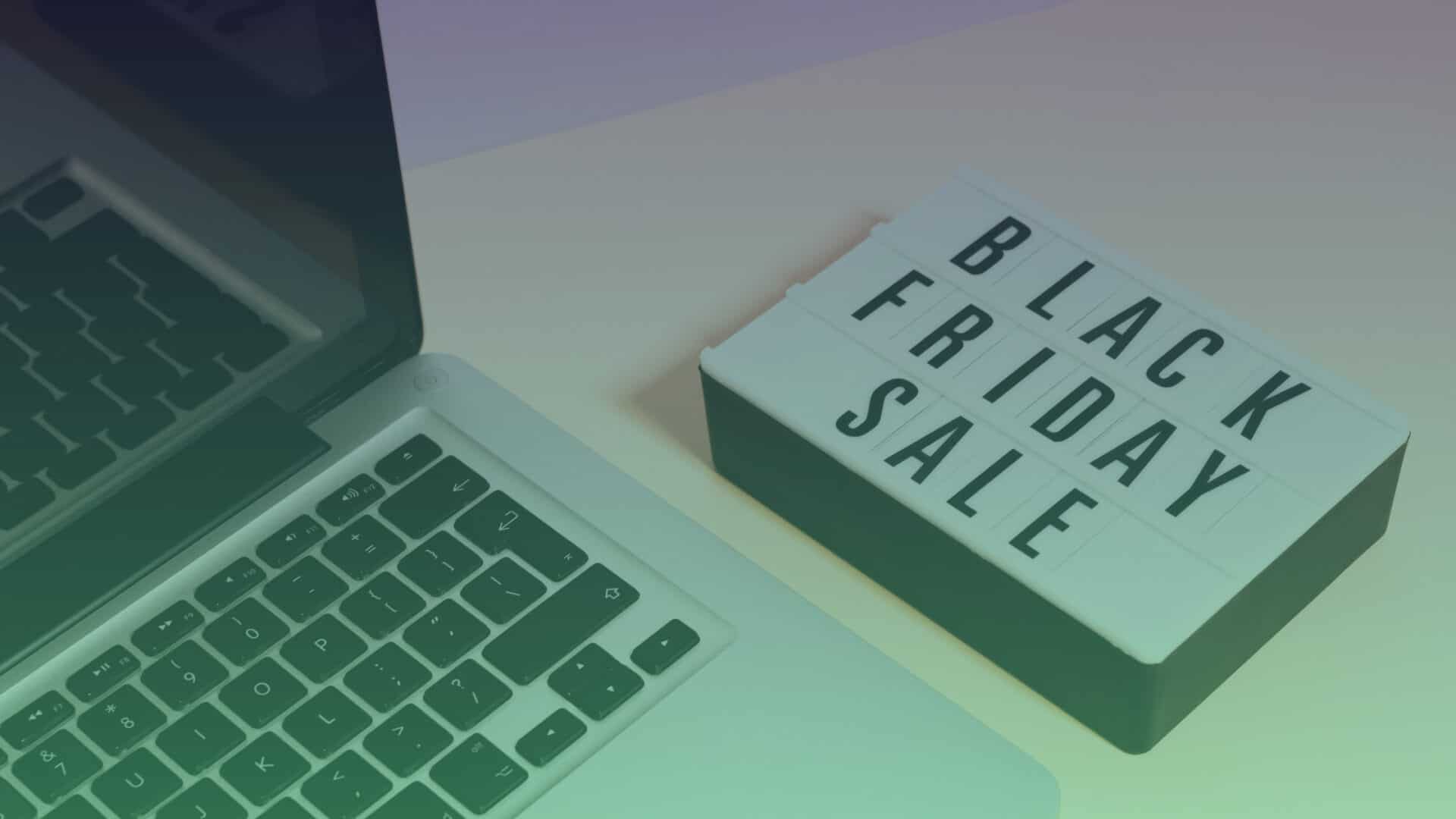 Laptop and a sign that says Black Friday Sale